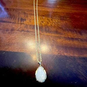 Kendra Scott Kiri white and gold pendant necklace.
